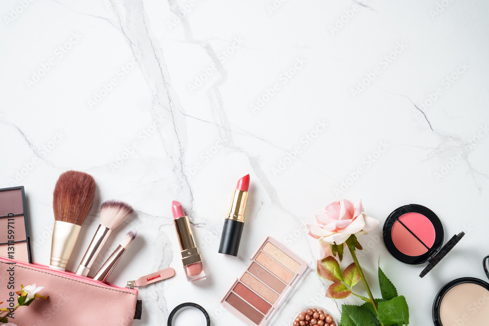 Make up products at white marble background.