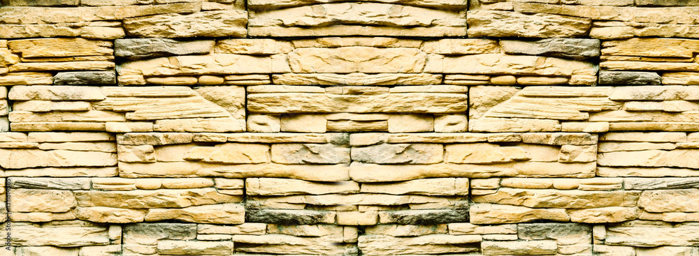 Sandstone bricks, wide wall made of weathered sandstones, stone wall background Sandstone bricks, wide wall made of weathered sandstones, stone wall background