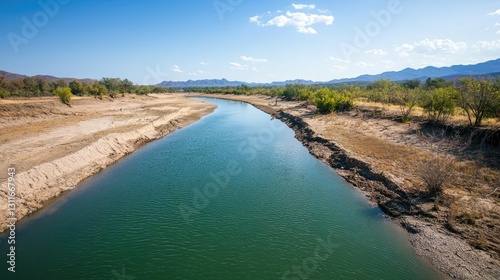 Wallpaper Mural Climate change drought concept. Stunning river view under a clear blue sky with surrounded green trees and mountains. Torontodigital.ca