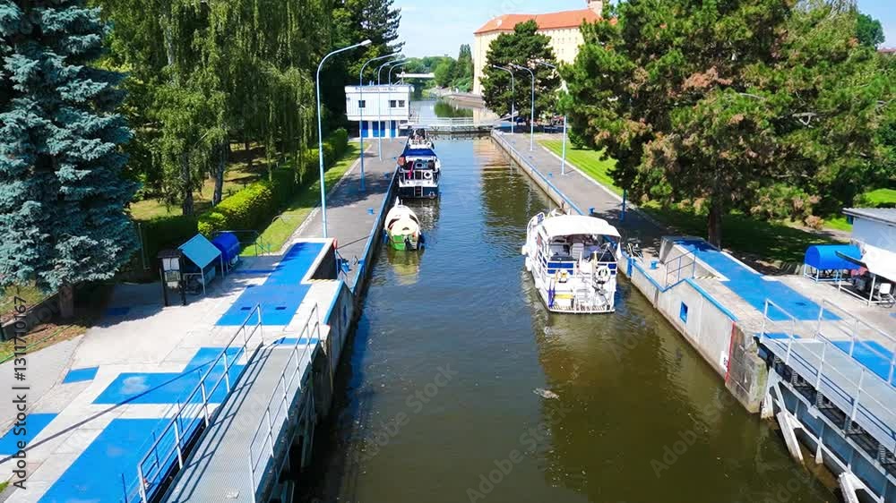 Podebrady- Czech- 27 July 2024: Ships sail into the water lock in the Elba river Podebrady- Czech- 27 July 2024: Ships sail into the water lock in the Elba river