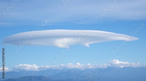 Majestic Lenticular Clouds Over Mountain Range