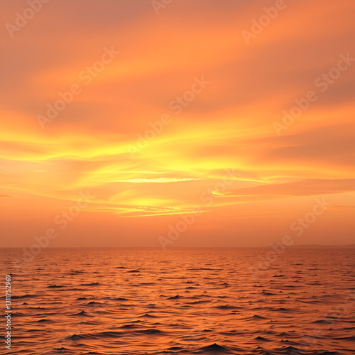 Sunrise sky with golden and pink hues spreading across a calm sea, perfect for morning-themed wellness and fitness promotions.
