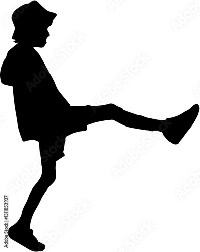 
silhouette of a boy kicking something