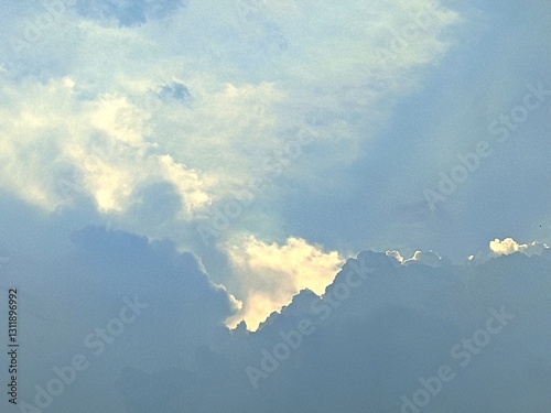 Beautiful clouds with sunlight, showcasing the natural beauty of the sky. Soft colors and gentle textures create a serene and calming image