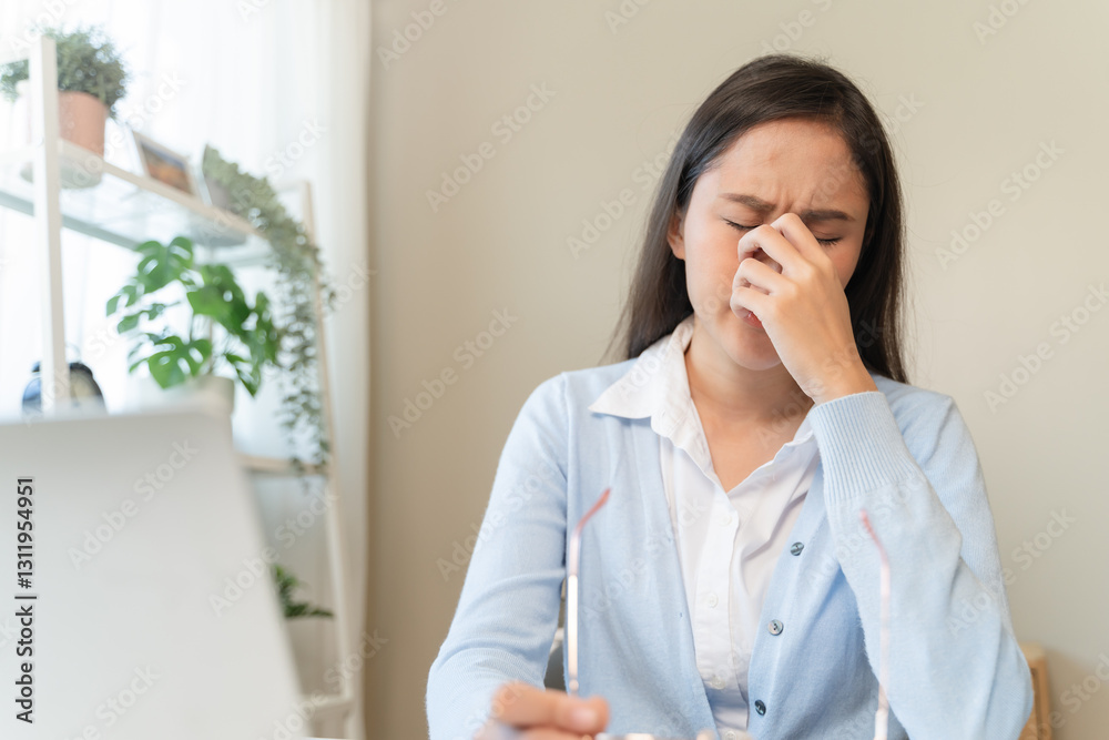 woman taking off glasses tired of computer work suffering from eye strain tension woman taking off glasses tired of computer work suffering from eye strain tension