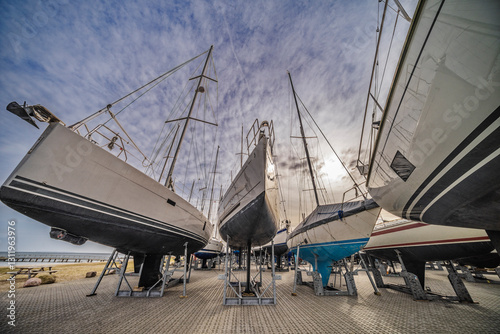 Row of Docked Sailboats in Harbor Storage Area During Offseason, Juelsminde, Denmark photo