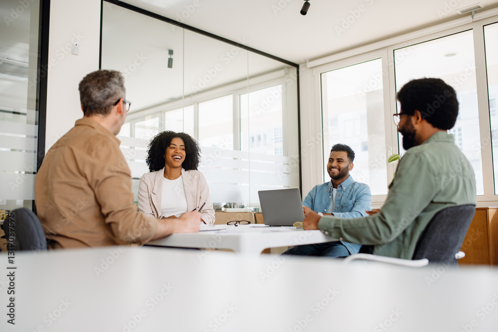 A group of professionals smiling and laughing in a business meeting, creating a positive and dynamic work environment. The atmosphere fosters teamwork, motivation, and success A group of professionals smiling and laughing in a business meeting, creating a positive and dynamic work environment. The atmosphere fosters teamwork, motivation, and success