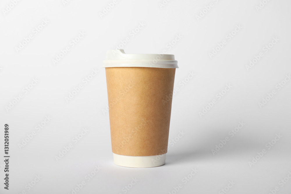 Paper cup with lid on white background. Mockup for design Paper cup with lid on white background. Mockup for design