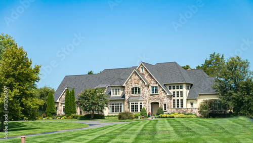 Large American detached house in Virginia with large lawn and blue skies