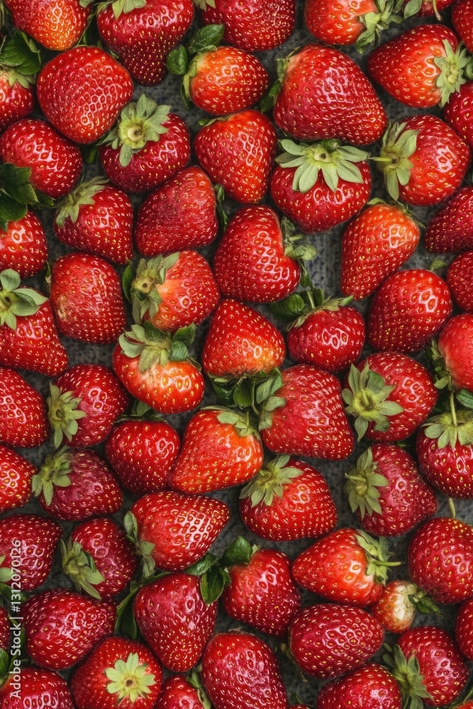 Fresh ripe red strawberries with green leaves top view Fresh ripe red strawberries with green leaves top view