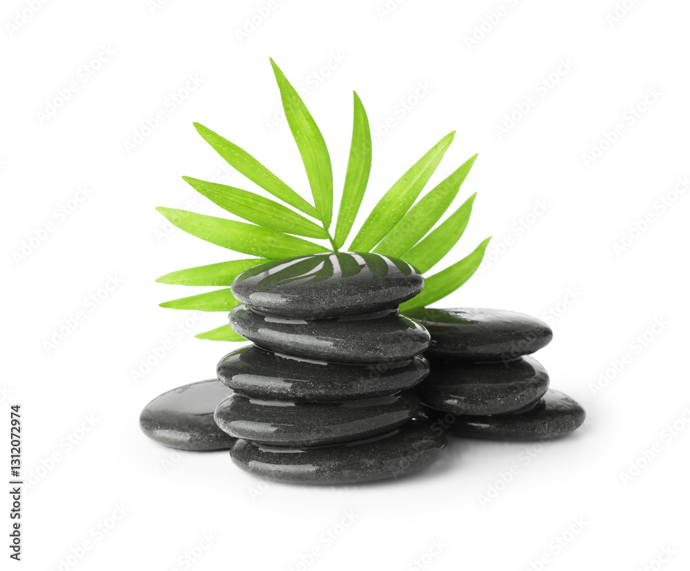 Naklejka premium Wet spa stones with leaves isolated on white