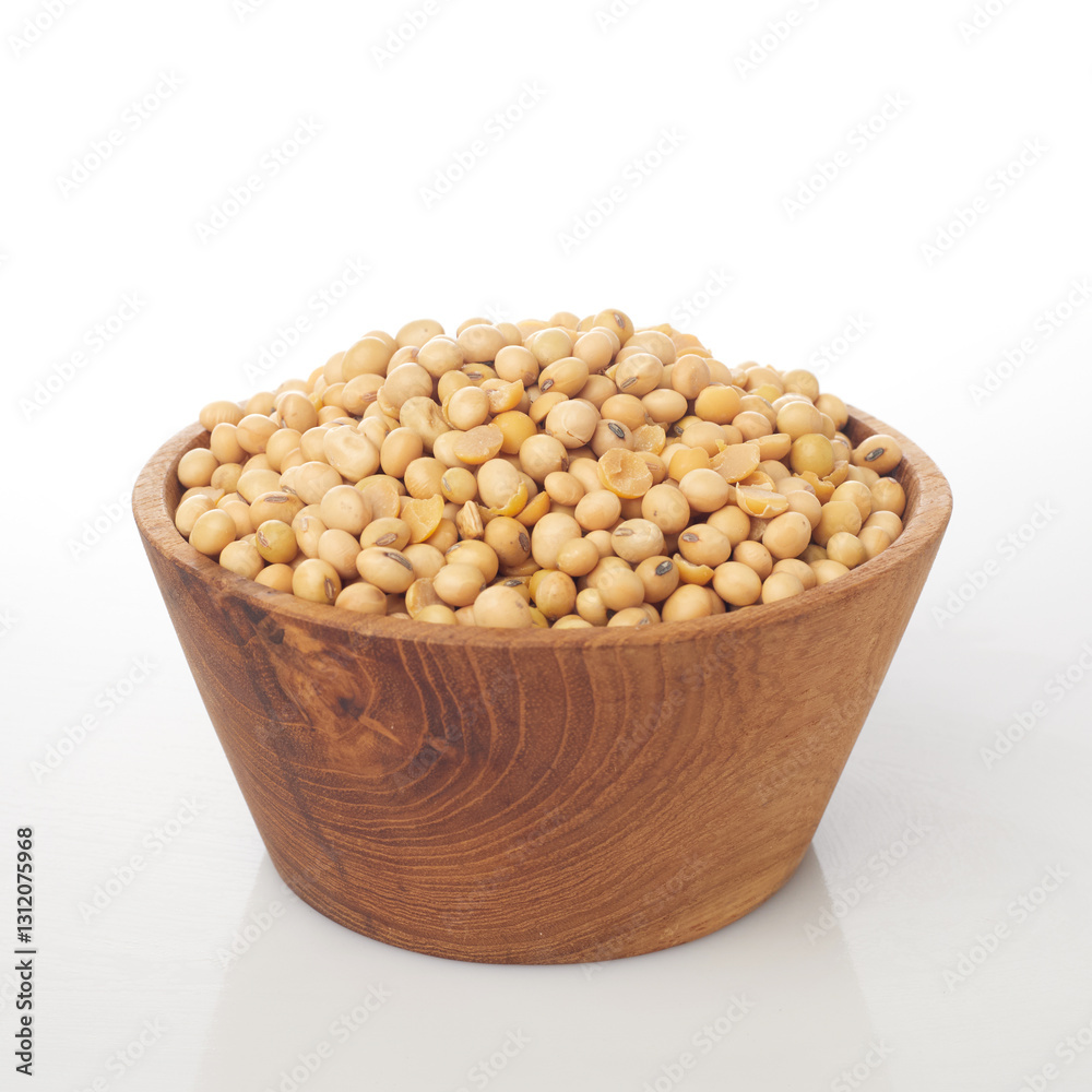 Isolated in White Background, a Wooden Bowl Holds an Abundance of Yellow Soybeans Showcasing Their Natural Texture Isolated in White Background, a Wooden Bowl Holds an Abundance of Yellow Soybeans Showcasing Their Natural Texture