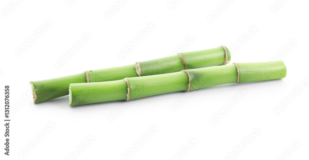 Fototapeta premium Cut green bamboo stems isolated on white