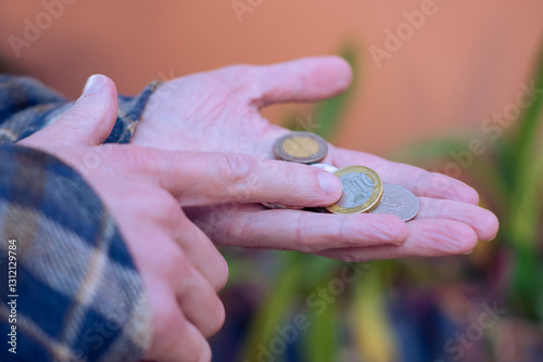 closeup male hands hold Moroccan dirham money, coins, count paper dirham banknotes, concept cash payments, monetary savings, save for vacation, exchange and cashing currency