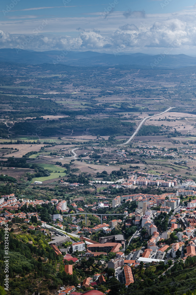A view of Covilha from the slopes of Serra da Estrela, Portugal, showcasing stunning landscapes and a blend of nature and architecture.