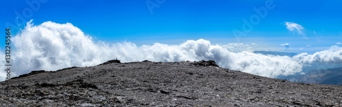 Cloudy over mountains on hiking trail to Mulhacen peak, Sierra Nevada National park, Andalusia, Spain