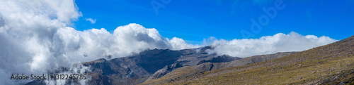 Cloudy over mountains on hiking trail to Mulhacen peak, Sierra Nevada National park, Andalusia, Spain