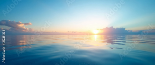 tranquil sunrise over a calm ocean with soft pastel colors