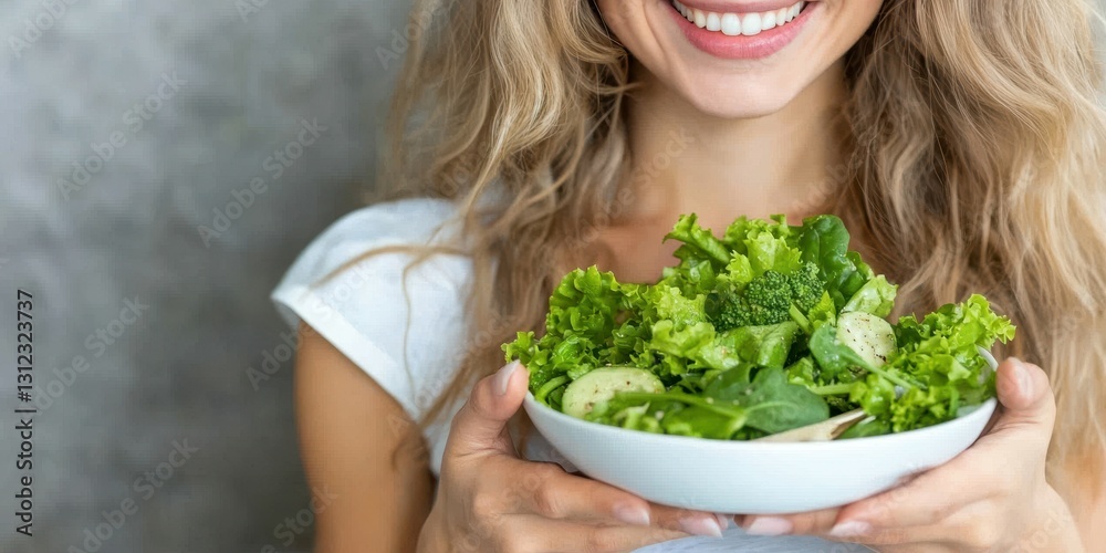 A joyful woman presents a large bowl filled with fresh greens and vegetables in a well-lit kitchen, highlighting her enthusiasm for healthy eating and meal preparation A joyful woman presents a large bowl filled with fresh greens and vegetables in a well-lit kitchen, highlighting her enthusiasm for healthy eating and meal preparation
