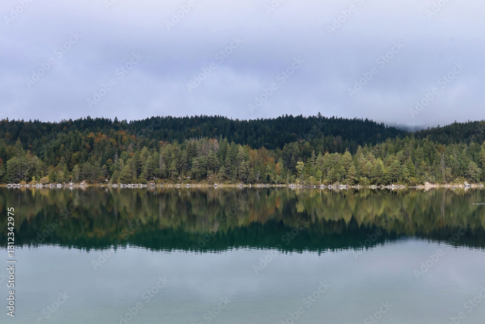 Reflection of trees across Eibsee Reflection of trees across Eibsee