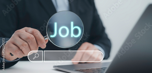 Foto Businessman holding a magnifying glass with the word Job symbolizing employment search and career opportunities