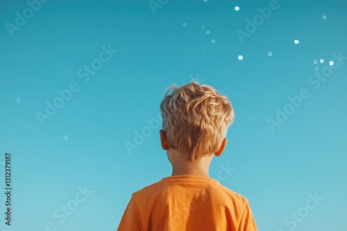 capture awe and wonder of young stargazer gazing at night sky resonating with spirit of human space exploration under photo