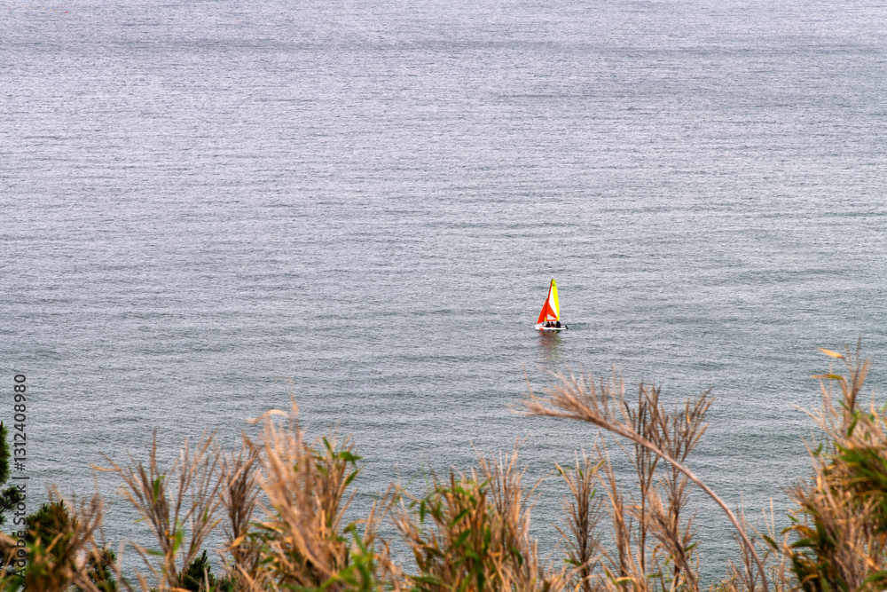 idyllic seascape with a sail boat on the sea