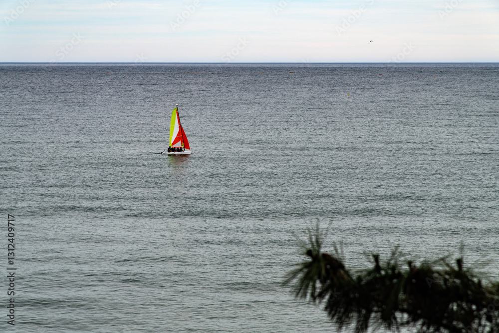 idyllic seascape with a sail boat on the sea