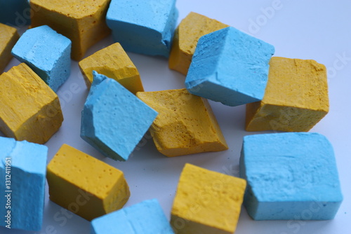 Paint for soy wax in the form of cubes, yellow 
paint, blue paint photo