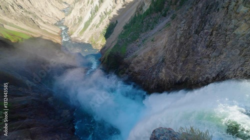  Looking over huge waterfall flowing through Yellowstone river valley. photo