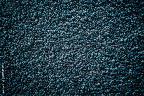 Detailed texture of a luxurious dark blue shag carpet, close-up photo