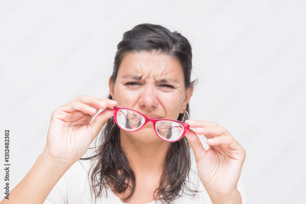 woman with headache from wearing high prescription glasses