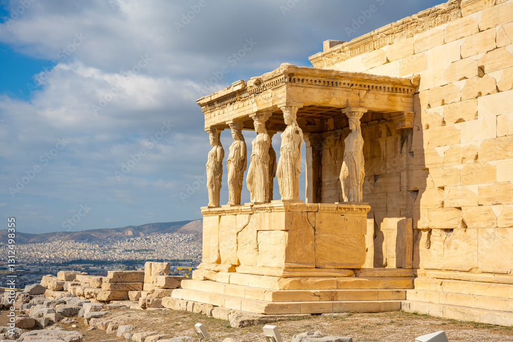 Fototapeta premium Ancient Erechtheion Greek temple with Porch of the Caryatids on the north side of the Acropolis in Athens, Greece. It was dedicated to both Athena and Poseidon. Caryatids at Porch of the Erechtheion,.