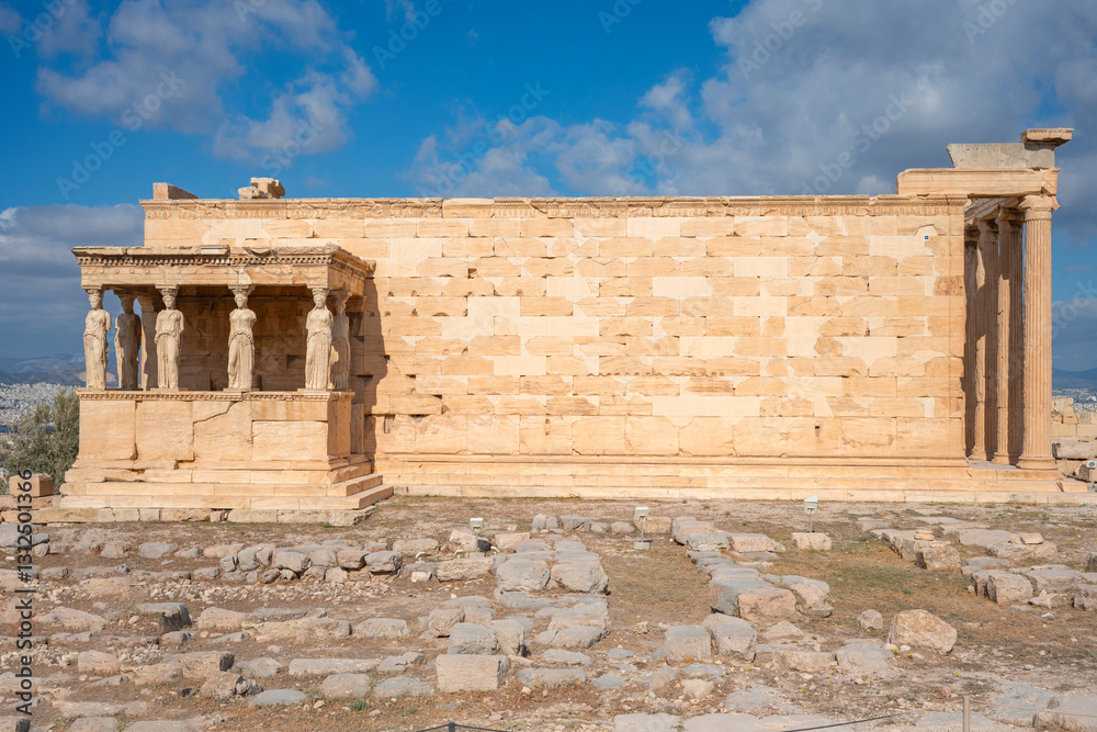Obraz premium Ancient Erechtheion Greek temple with Porch of the Caryatids on the north side of the Acropolis in Athens, Greece. It was dedicated to both Athena and Poseidon. Caryatids at Porch of the Erechtheion,.
