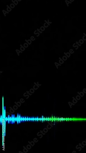 Dynamic audio visualizer pulses with vibrant green and blue waves against black background