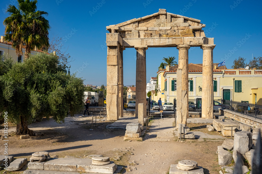 Fototapeta premium The most famous architectural landmarks of ancient greek heritage located in the Plaka district in Athens, Greece: the library of Hadrian, Wind tower, medieval mosque