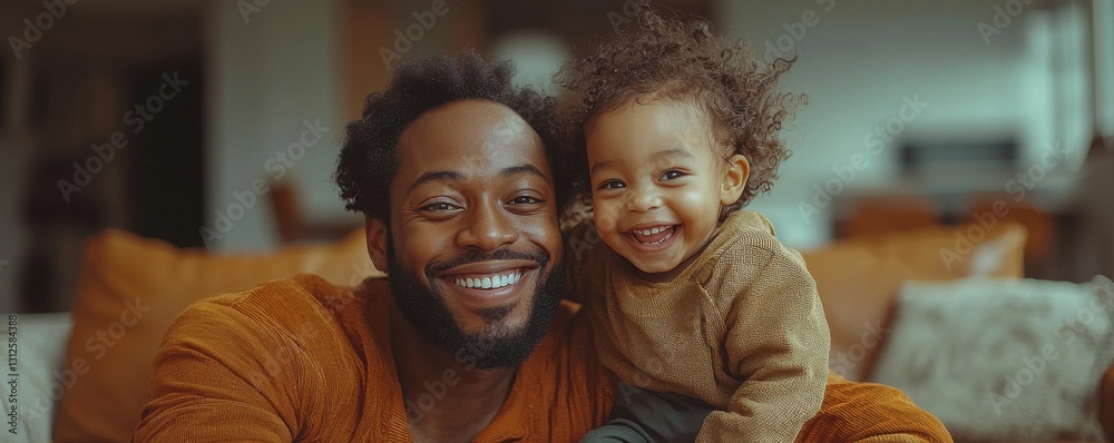 Fototapeta premium Smiling father and child bonding together on a cozy living-room couch