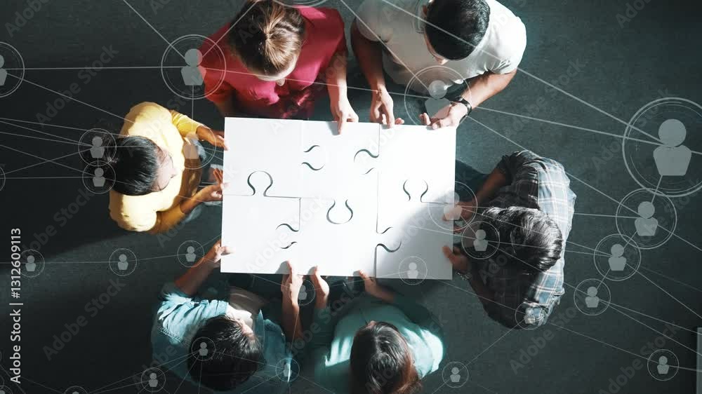 Top down view of business people gathering jigsaw together at meeting. Aerial view of diverse team collect or put piece of white puzzle together with computing global networking community. Symposium.