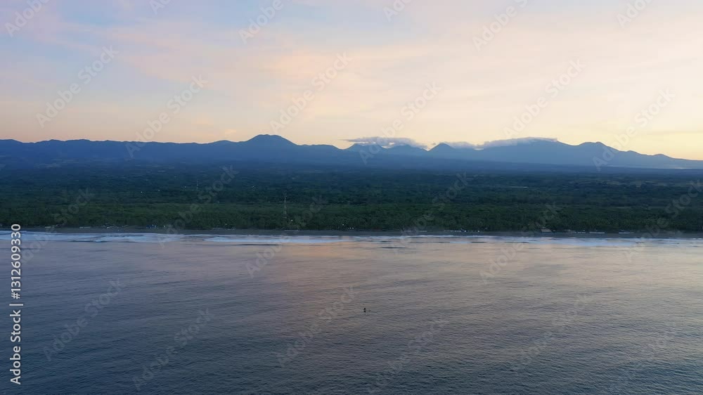View from above of the ocean and a small fishing boat. The coastline, along which there are villas and endless forests. Evening. High quality aerial drone shot, 4K View from above of the ocean and a small fishing boat. The coastline, along which there are villas and endless forests. Evening. High quality aerial drone shot, 4K