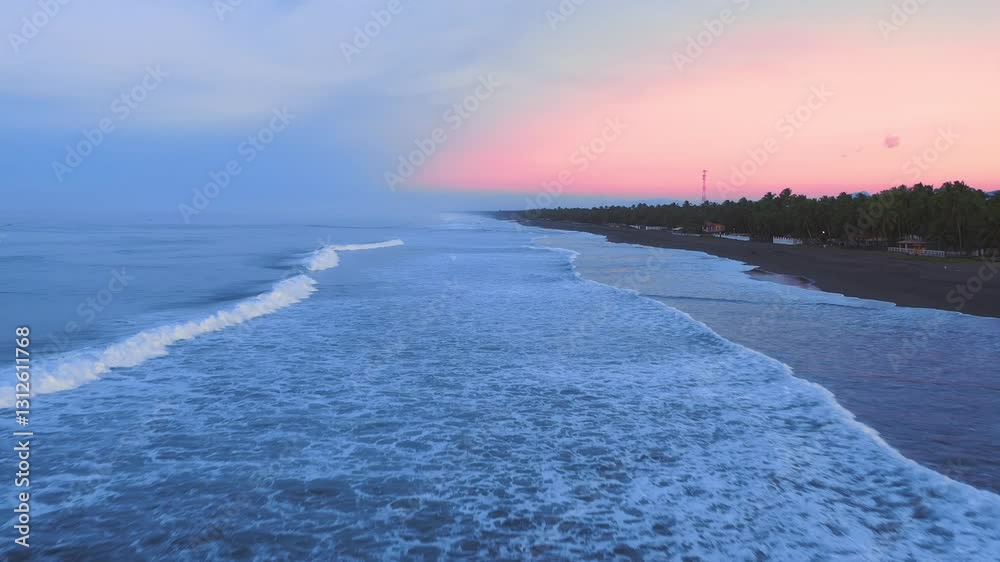 Drone flies over the water along the shore, watching large rain clouds approach the coast. The wind has raised the waves with white crests. Sunset. Aerial drone shot, 4K Drone flies over the water along the shore, watching large rain clouds approach the coast. The wind has raised the waves with white crests. Sunset. Aerial drone shot, 4K