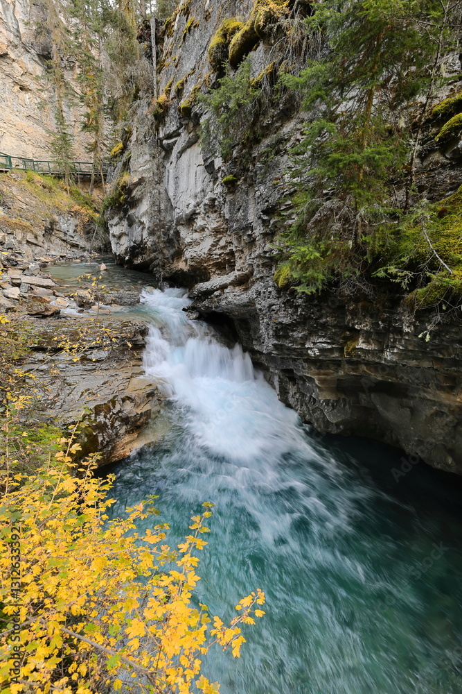 Scenic green, turquoise blue water of Johnston Crek running along the bottom of Johnston Canyon through a series of rapids. Banff-Alberta-Canada-014 Scenic green, turquoise blue water of Johnston Crek running along the bottom of Johnston Canyon through a series of rapids. Banff-Alberta-Canada-014