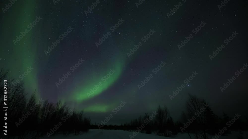 Aurora Borealis night sky above winter forests of Lapland, Kittilä. Time lapse in 4K. The northern lights are in Sweden, Finland, Norway and Iceland.