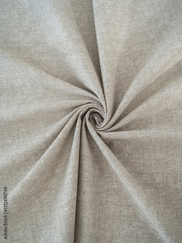 Soft beige fabric. Beautiful folds. Closeup.