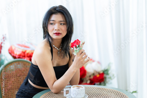 Obraz na płótnie valentine's day, Portrait beautiful asian people woman fashion model in summer Black dress and coffee in cup holding bouquet of red roses in the living room inside or cafe w salonie