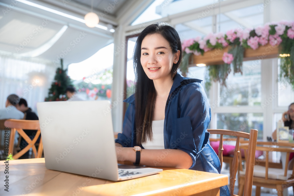 Asian freelance people business female talking making using casual working with laptop computer and coffee at home in the living room indoors artificial rose bouquet of red and pink roses rose vase