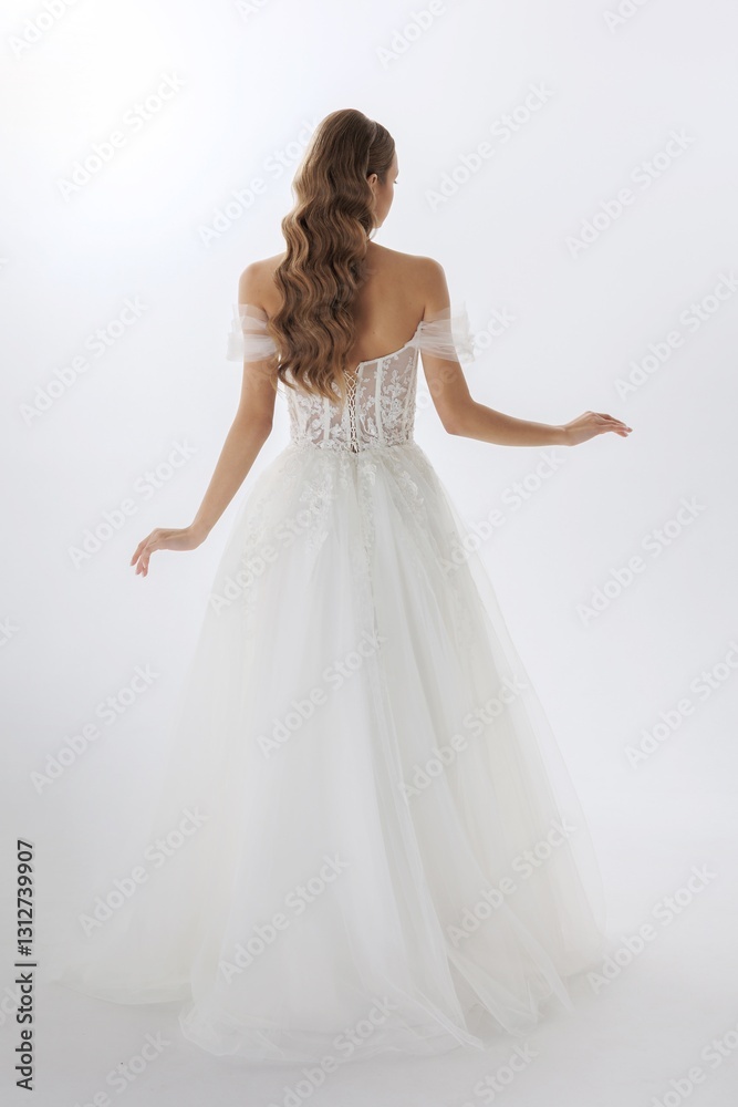 Elegant bride showcasing a stunning back view of a white wedding dress with intricate lace details in a light-filled studio Elegant bride showcasing a stunning back view of a white wedding dress with intricate lace details in a light-filled studio