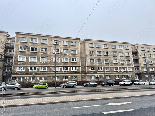 view of an old gray building on a Warsaw street on a cold winter day
