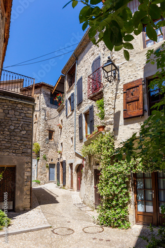 Fototapeta Naklejka Na Ścianę i Meble -  Typical alley in Châtillon en Diois, Drôme department, southeastern France. Medieval streets and houses in the center of the village. Châtillon is one of Most Beautiful Villages of France.