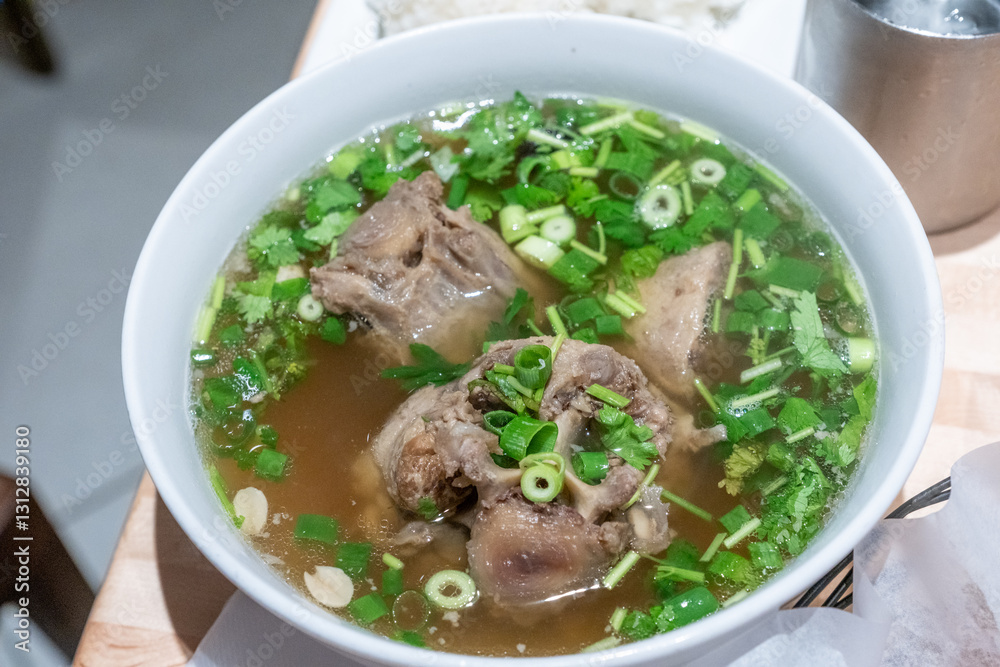 Overhead shot of Oxtail Soup with broth and green onion and cilantro Overhead shot of Oxtail Soup with broth and green onion and cilantro