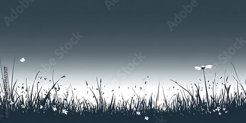 Silhouette of grass and flowers against a twilight sky. Simple, serene nature scene
